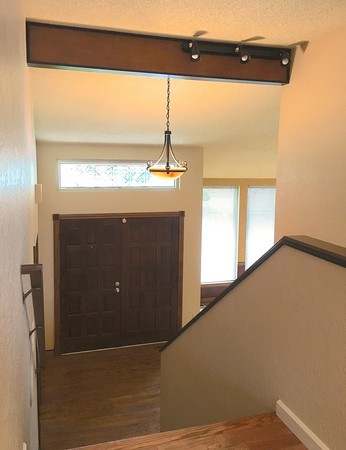 Upper floor view of entry and living room